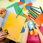 Children making rockets from craft material.